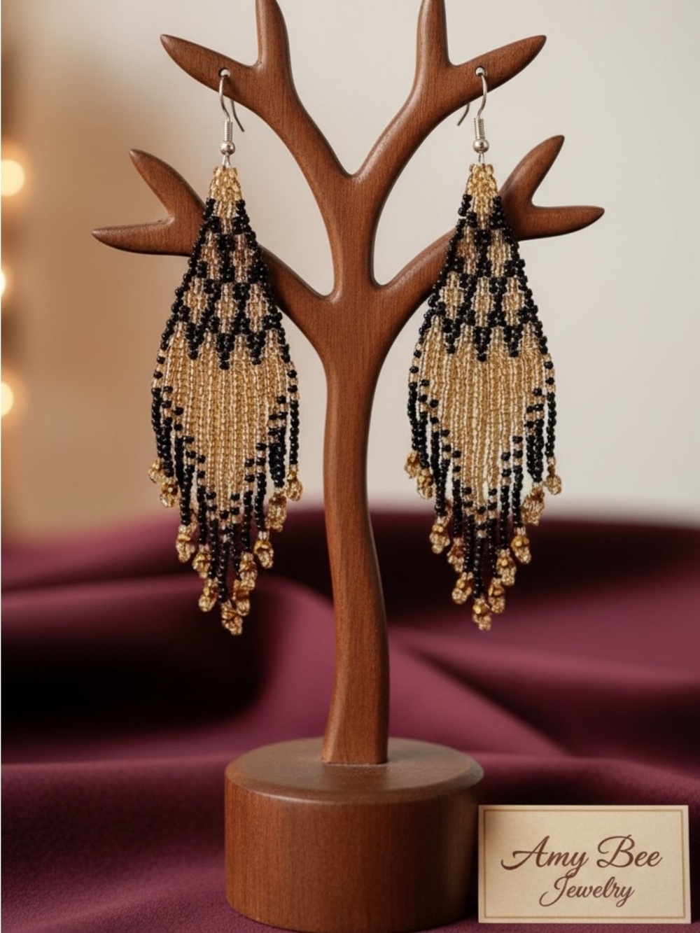 Shimmering Gold and Black Geo patterned beaded tassel earrings. New.